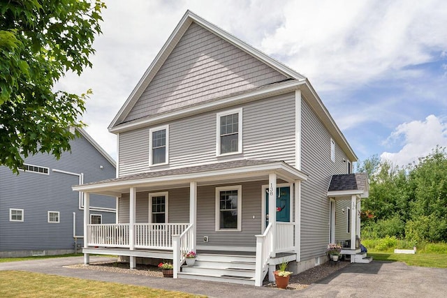 136-138 Blue Spruce Farm Rd, Westbrook, ME 04092 - view of front of house featuring covered porch and a shingled roof