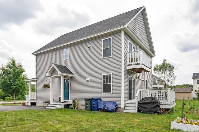 136-138 Blue Spruce Farm Rd, Westbrook, ME 04092 - rear view of house with a balcony, a yard, and roof with shingles