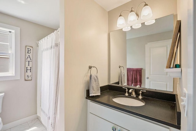 136-138 Blue Spruce Farm Rd, Westbrook, ME 04092 - bathroom with vanity, marble look tiles, and a shower with curtain