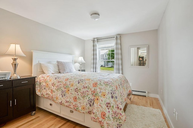 136-138 Blue Spruce Farm Rd, Westbrook, ME 04092 - bedroom with a baseboard radiator and light wood-type flooring