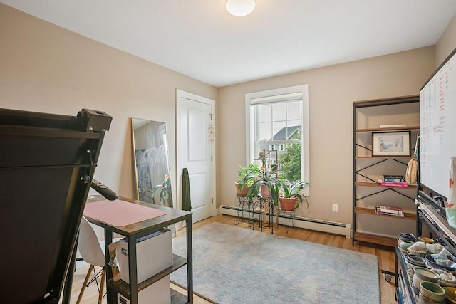 136-138 Blue Spruce Farm Rd, Westbrook, ME 04092 - home office with a baseboard radiator and wood finished floors