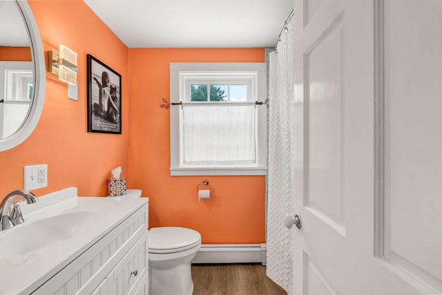 1511 Alna Rd, Alna, ME 04535 - bathroom featuring a baseboard radiator, wood finished floors, and vanity