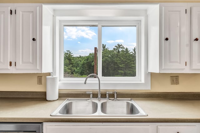 1511 Alna Rd, Alna, ME 04535 - kitchen featuring white cabinets, dishwashing machine, and plenty of natural light