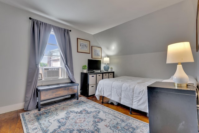 12 Maple St, Bath, ME 04530 - bedroom with vaulted ceiling, cooling unit, and wood finished floors