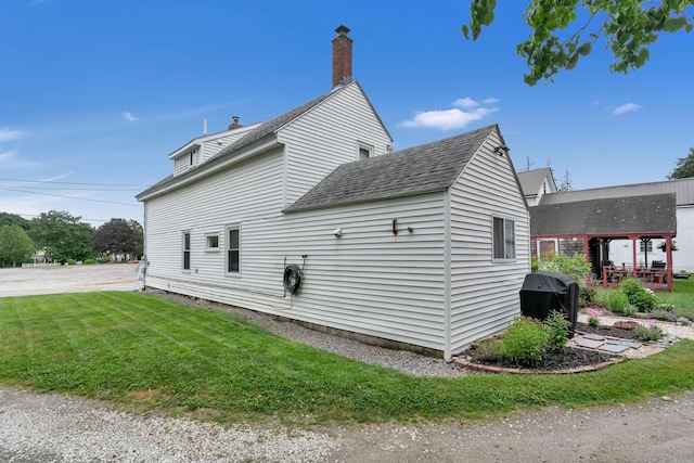 12 Maple St, Bath, ME 04530 - view of home's exterior with a lawn, roof with shingles, and a chimney