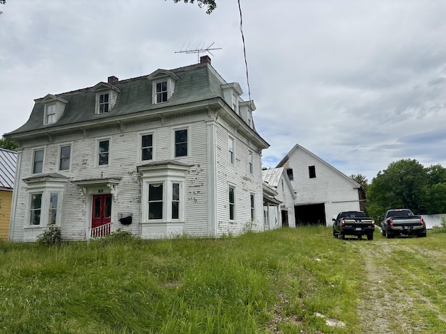53 Main St, Phillips, ME 04966 - second empire-style home with mansard roof and a chimney