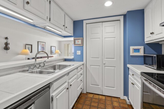 191 E Grand Ave Unit 506, Old Orchard Beach, ME 04064 - kitchen with stainless steel appliances, white cabinetry, light countertops, and recessed lighting