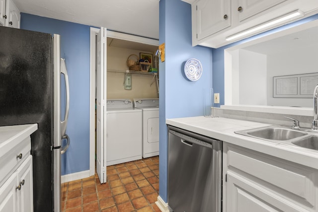 191 E Grand Ave Unit 506, Old Orchard Beach, ME 04064 - kitchen featuring stainless steel appliances, washer and clothes dryer, white cabinetry, and light countertops