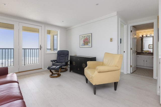 191 E Grand Ave Unit 506, Old Orchard Beach, ME 04064 - sitting room with plenty of natural light and light wood-style flooring