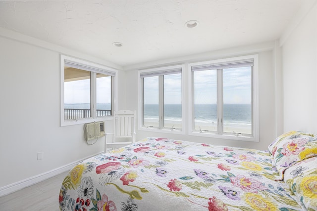 191 E Grand Ave Unit 506, Old Orchard Beach, ME 04064 - bedroom with multiple windows, a water view, and an AC wall unit