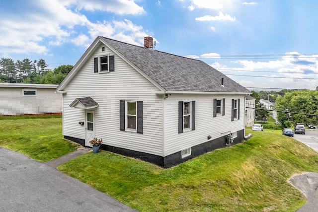 233 Northern Ave, Augusta, ME 04330 - view of home's exterior with a shingled roof, a lawn, and a chimney