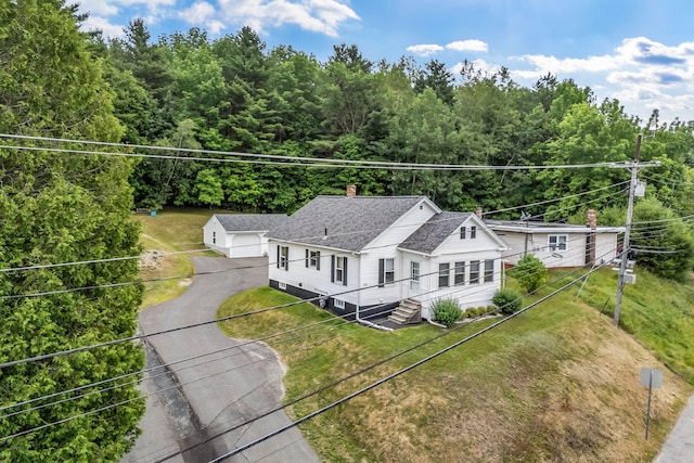 233 Northern Ave, Augusta, ME 04330 - view of front of house with a detached garage, an outdoor structure, a chimney, and a front yard