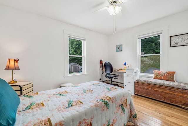 233 Northern Ave, Augusta, ME 04330 - bedroom featuring multiple windows, wood finished floors, ceiling fan, and an office area