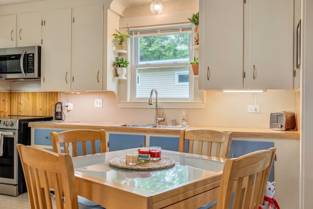 233 Northern Ave, Augusta, ME 04330 - kitchen featuring stainless steel appliances, white cabinets, and light countertops