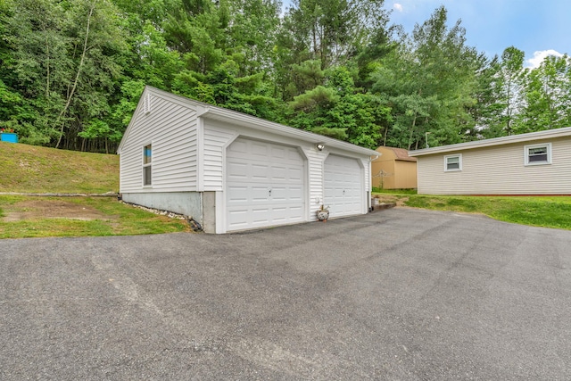 233 Northern Ave, Augusta, ME 04330 - detached garage featuring view of wooded area