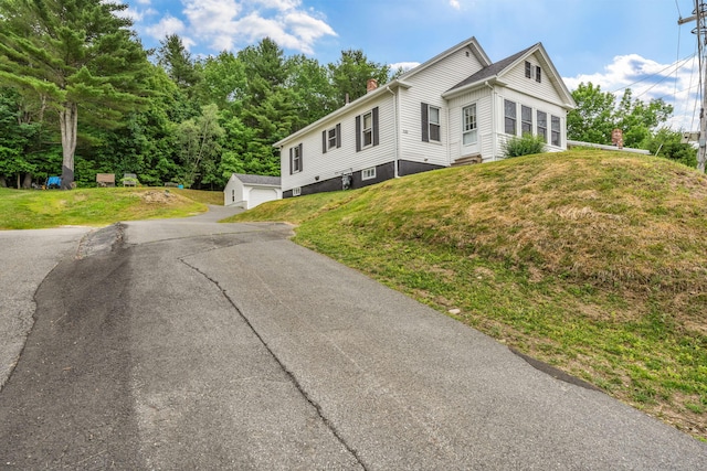 233 Northern Ave, Augusta, ME 04330 - view of front facade with a chimney, a front yard, and a garage