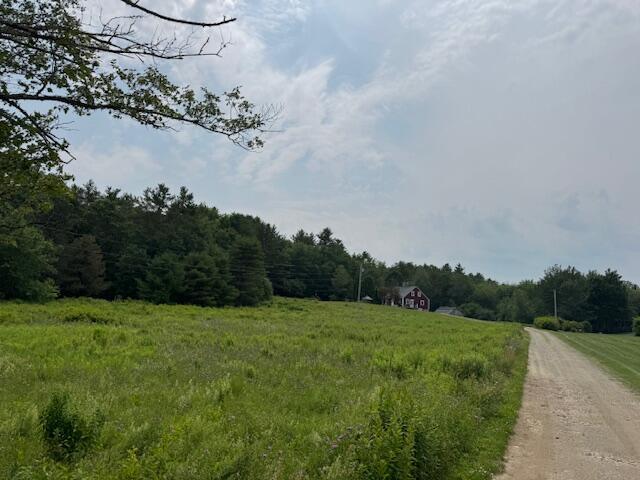 152 Cross Rd, Alna, ME 04535 - view of dirt / gravel road with a forest view and a view of countryside