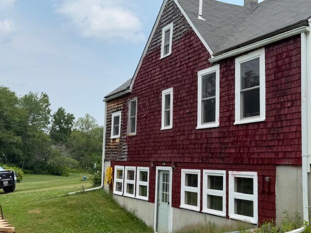152 Cross Rd, Alna, ME 04535 - view of property exterior with a shingled roof, a chimney, and a lawn