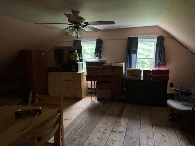 152 Cross Rd, Alna, ME 04535 - bedroom featuring hardwood / wood-style flooring, vaulted ceiling, multiple windows, and ceiling fan