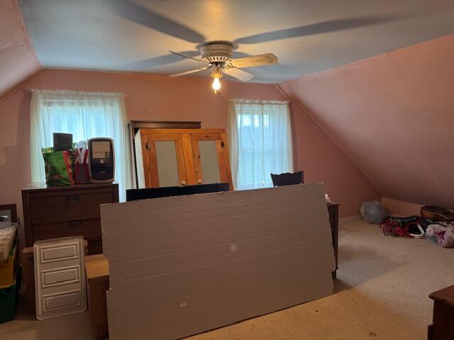 152 Cross Rd, Alna, ME 04535 - carpeted bedroom with vaulted ceiling and a ceiling fan