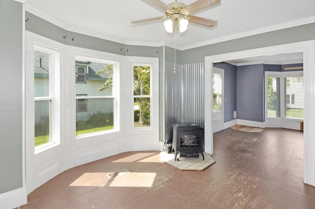 56 Holyoke St, Brewer, ME 04412 - unfurnished living room featuring plenty of natural light, a wood stove, a ceiling fan, and ornamental molding