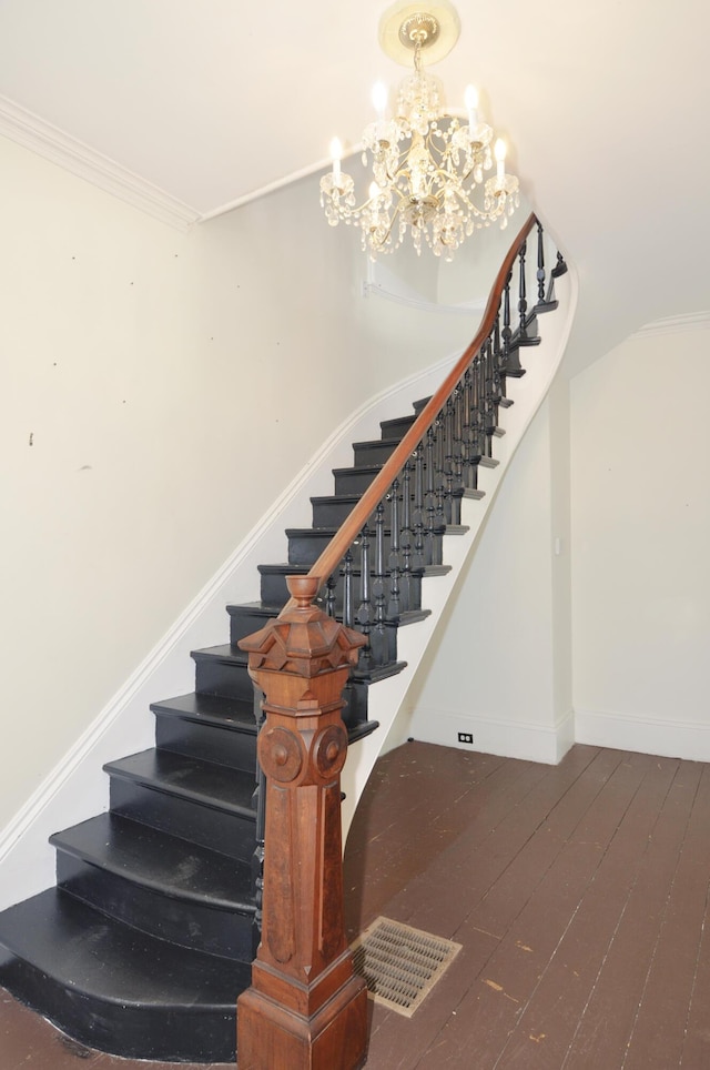 56 Holyoke St, Brewer, ME 04412 - staircase featuring a chandelier, hardwood / wood-style flooring, and crown molding
