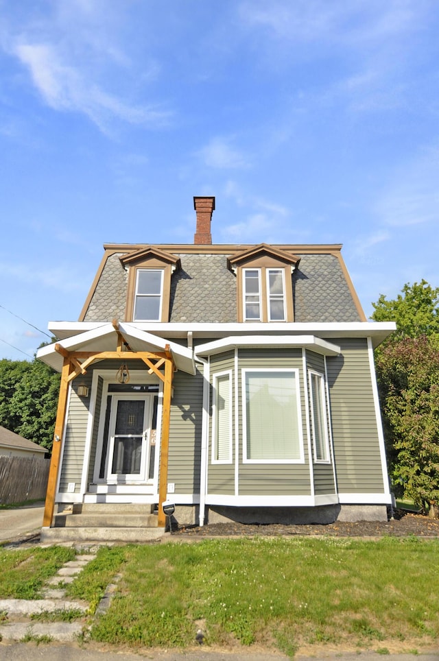 56 Holyoke St, Brewer, ME 04412 - victorian home with a chimney and a shingled roof