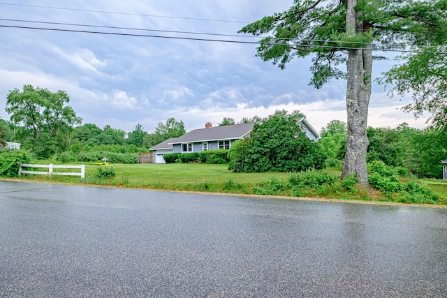 704 Brighton Hill Rd, Minot, ME 04258 - view of front of house featuring driveway and a chimney