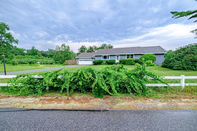 704 Brighton Hill Rd, Minot, ME 04258 - single story home with an attached garage and a chimney
