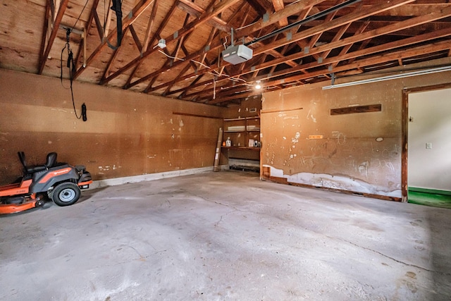 704 Brighton Hill Rd, Minot, ME 04258 - garage featuring a garage door opener