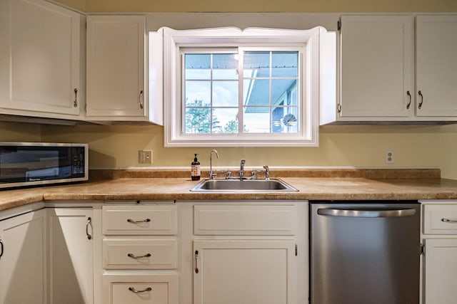 704 Brighton Hill Rd, Minot, ME 04258 - kitchen with stainless steel appliances, white cabinetry, and light countertops