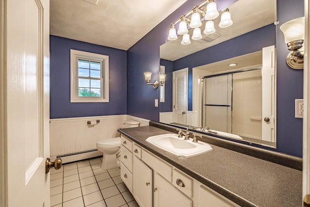704 Brighton Hill Rd, Minot, ME 04258 - full bath with a baseboard radiator, tile patterned flooring, an enclosed shower, a wainscoted wall, and vanity