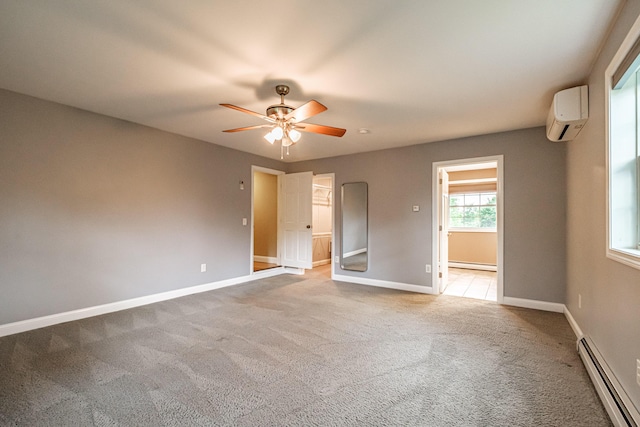 704 Brighton Hill Rd, Minot, ME 04258 - unfurnished room featuring baseboard heating, a wall unit AC, a ceiling fan, and light carpet
