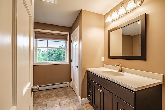 704 Brighton Hill Rd, Minot, ME 04258 - bathroom featuring a baseboard heating unit and vanity