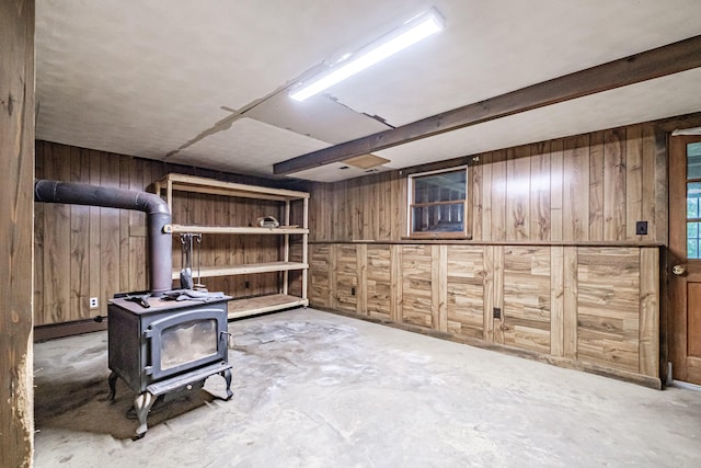 704 Brighton Hill Rd, Minot, ME 04258 - finished basement featuring wooden walls and a wood stove