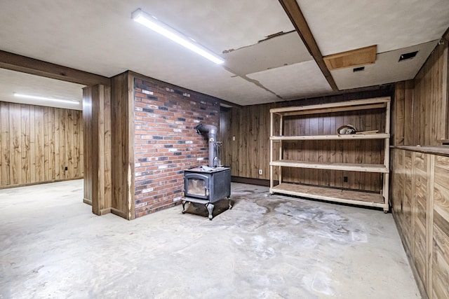 704 Brighton Hill Rd, Minot, ME 04258 - finished basement with wooden walls and a wood stove