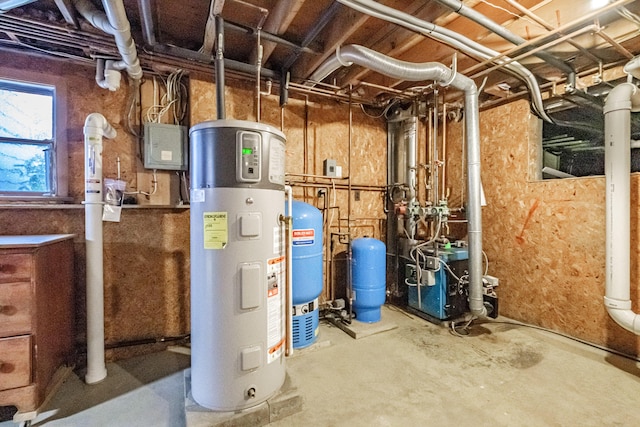 704 Brighton Hill Rd, Minot, ME 04258 - utility room featuring water heater and a heating unit