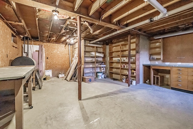 704 Brighton Hill Rd, Minot, ME 04258 - unfinished below grade area with a workshop area