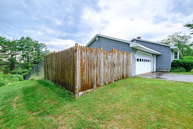 704 Brighton Hill Rd, Minot, ME 04258 - view of home's exterior featuring driveway and a garage