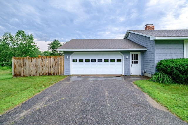 704 Brighton Hill Rd, Minot, ME 04258 - view of front facade featuring driveway, a chimney, a garage, and a shingled roof