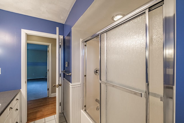 704 Brighton Hill Rd, Minot, ME 04258 - full bathroom featuring enclosed tub / shower combo, vanity, tile patterned floors, and baseboard heating