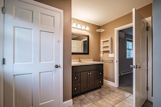 704 Brighton Hill Rd, Minot, ME 04258 - bathroom featuring a baseboard heating unit, vanity, and a wall mounted air conditioner