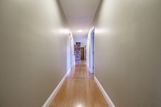 704 Brighton Hill Rd, Minot, ME 04258 - corridor with light wood-type flooring and baseboards