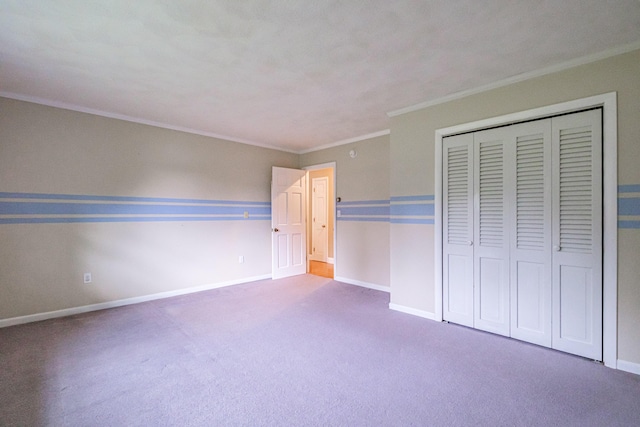 704 Brighton Hill Rd, Minot, ME 04258 - unfurnished bedroom with ornamental molding, carpet, and a closet