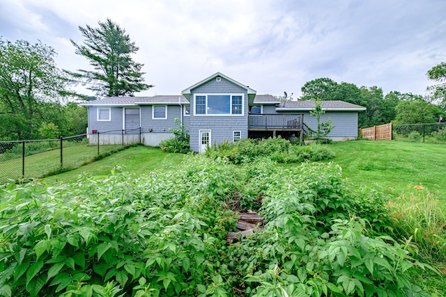 704 Brighton Hill Rd, Minot, ME 04258 - rear view of property with a fenced backyard, a wooden deck, and a garden