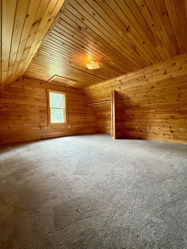 69 Lafayette St, Calais, ME 04619 - bonus room featuring wood ceiling, wooden walls, vaulted ceiling, and carpet
