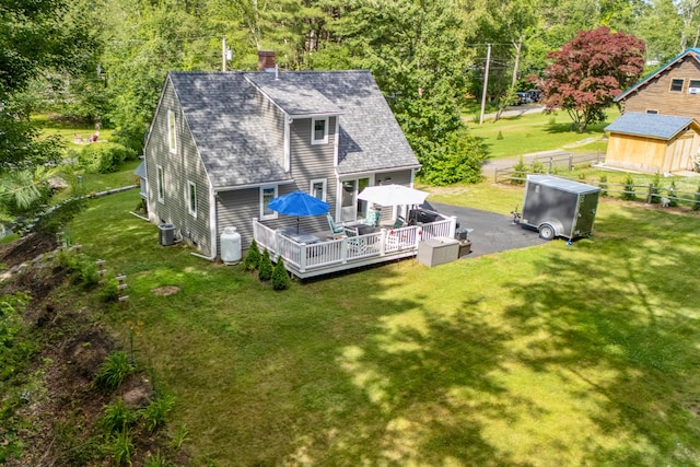 68 Appletree Ln, Wells, ME 04090 - rear view of house with a wooden deck, a chimney, and a shingled roof