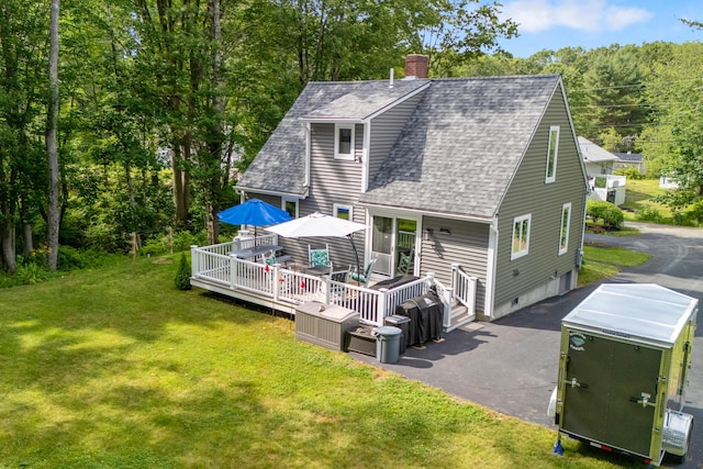 68 Appletree Ln, Wells, ME 04090 - back of house with a shingled roof, a chimney, a deck, a lawn, and driveway