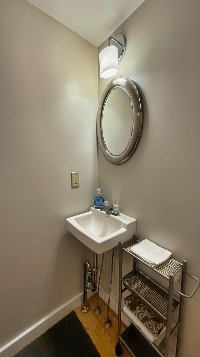 9 County Rd, Lubec, ME 04652 - bathroom with baseboards and wood finished floors