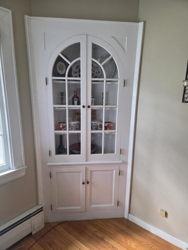 125 Connecticut Ave, Millinocket, ME 04462 - detailed view of baseboard heating and wood finished floors